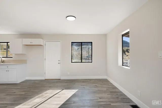 a view of an empty room and window