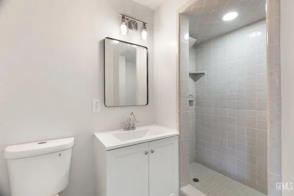 a bathroom with a toilet sink and shower