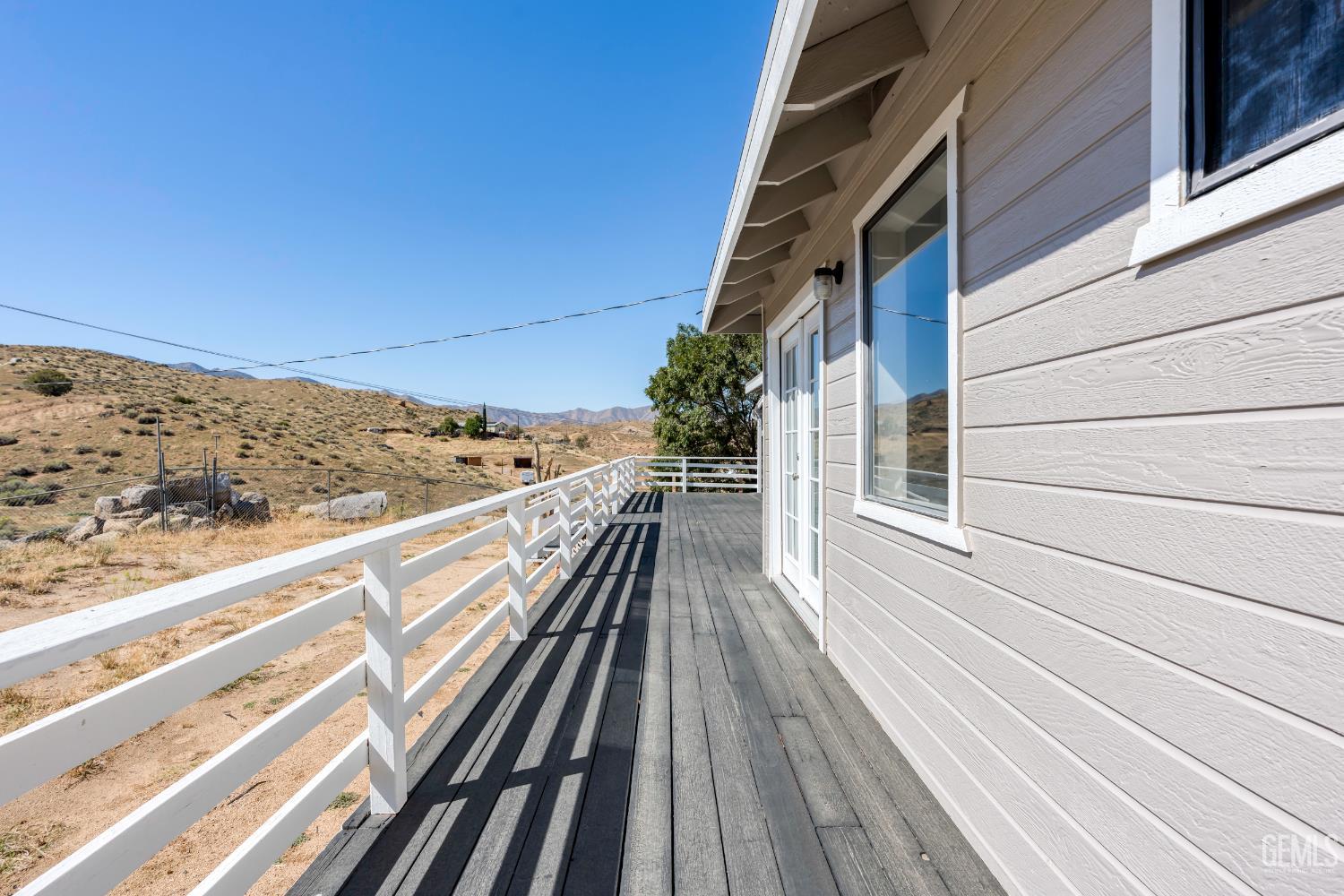 Undisclosed Address Weldon, CA 93283 - Photo 9 of 48 a view of balcony with wooden floor and fence