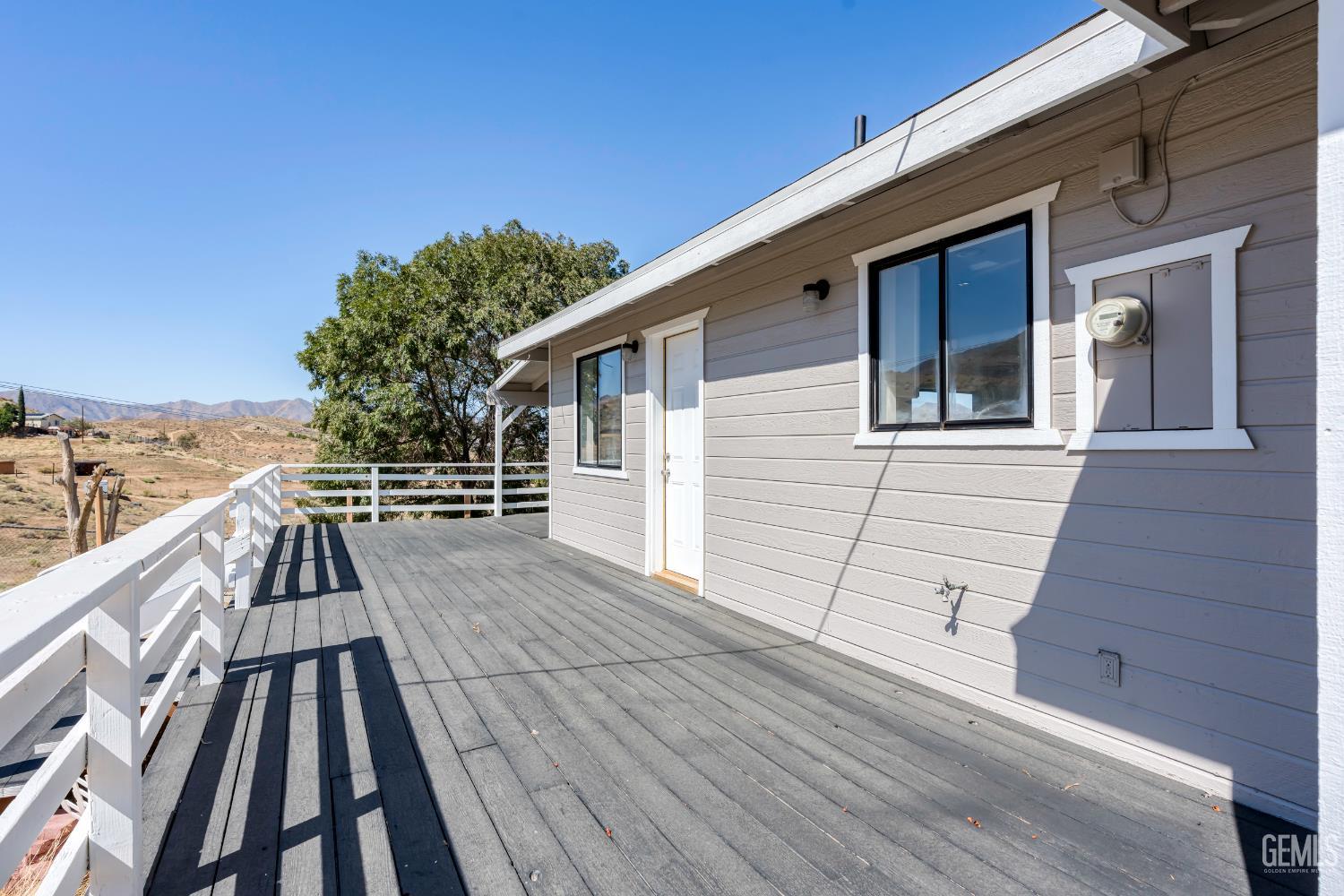 Undisclosed Address Weldon, CA 93283 - Photo 10 of 48 a view of balcony with wooden floor and fence
