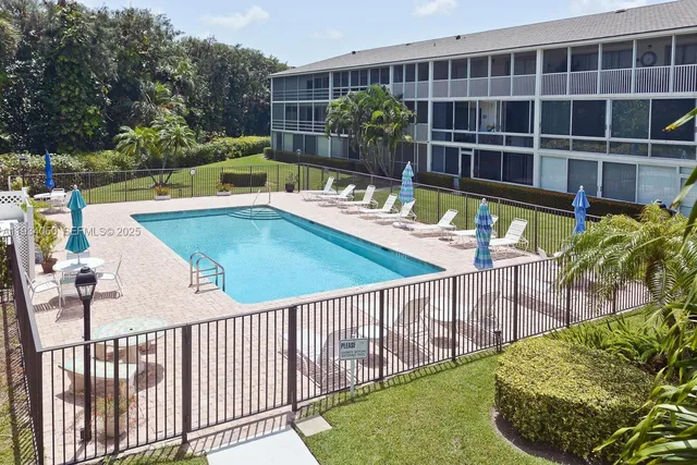 a view of a swimming pool with a patio