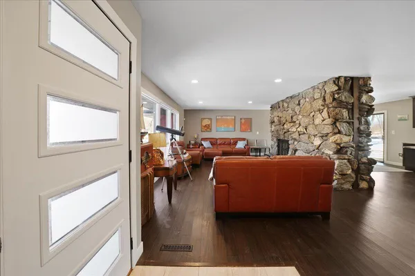 a living room with furniture and a fireplace