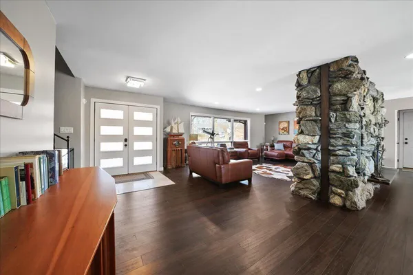 a living room with furniture and a large window