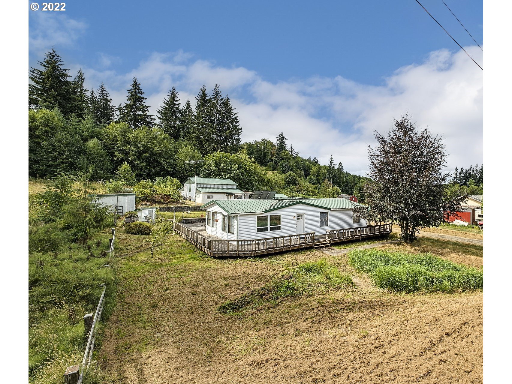 31934 Highland Road Rainier, OR 97048 - Photo 1 of 27 a view of a house with yard and sitting area