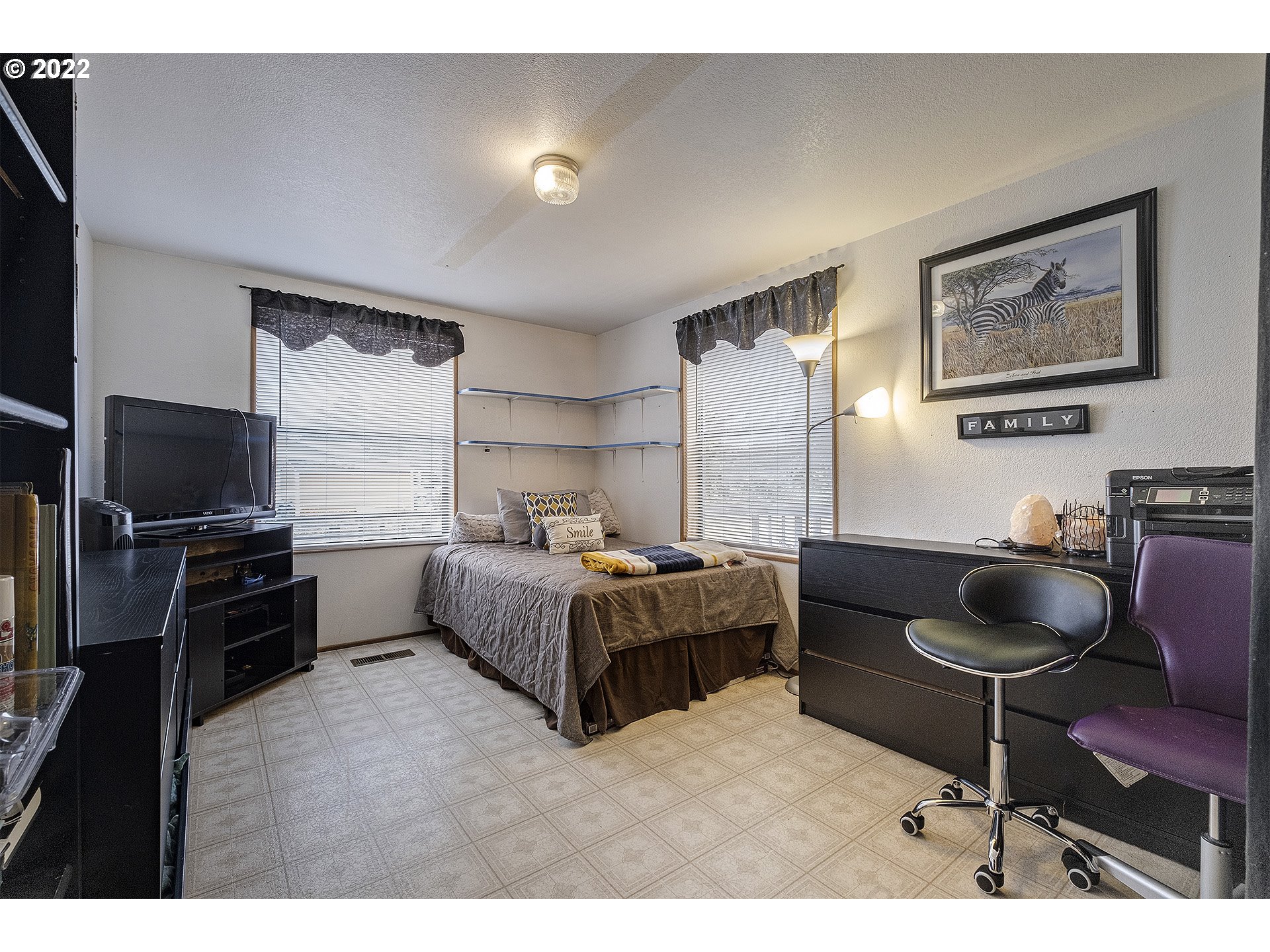 31934 Highland Road Rainier, OR 97048 - Photo 15 of 27 a bedroom with a bed and a flat screen tv