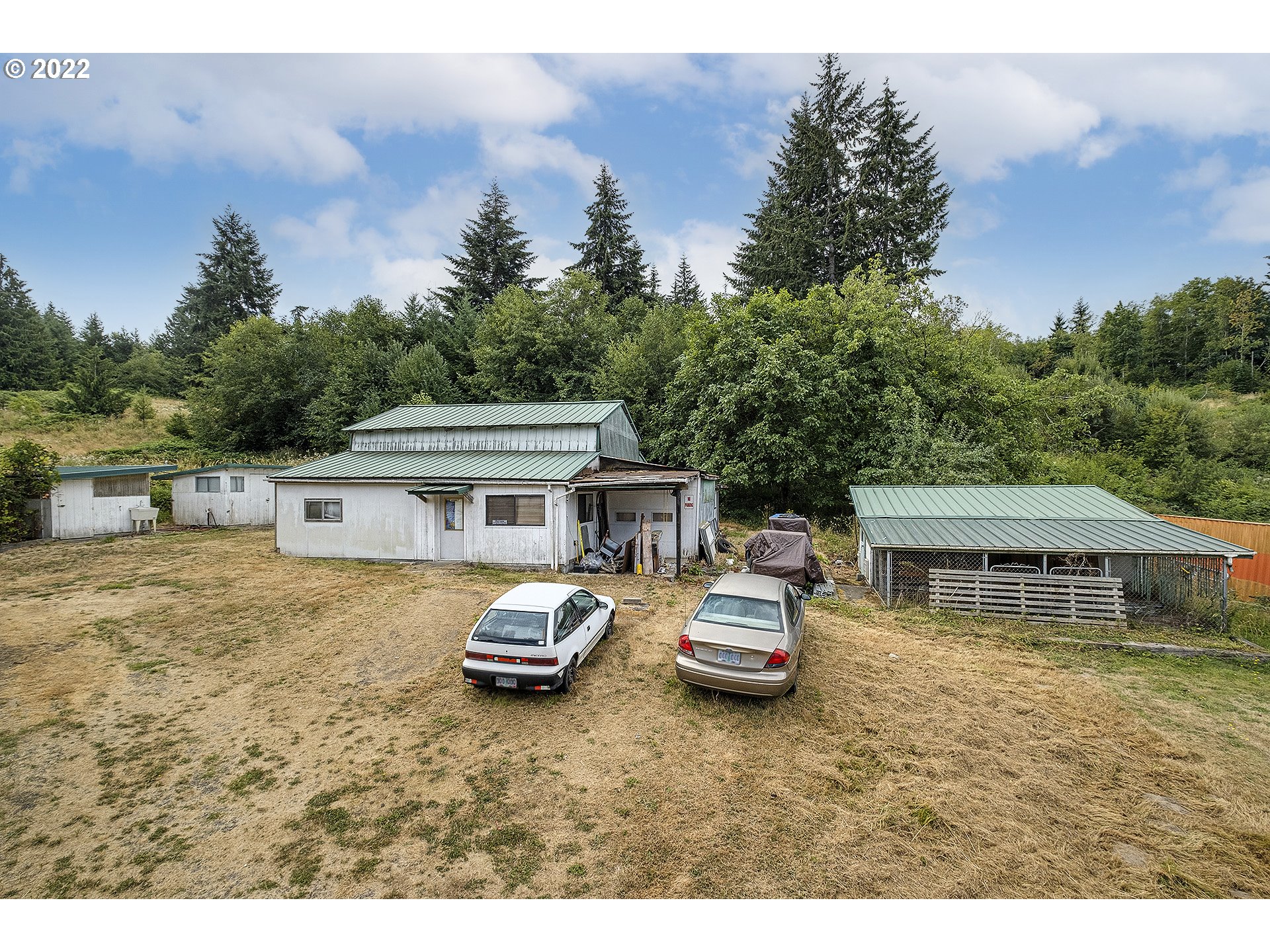 31934 Highland Road Rainier, OR 97048 - Photo 24 of 27 a view of a house with lawn chairs and a yard
