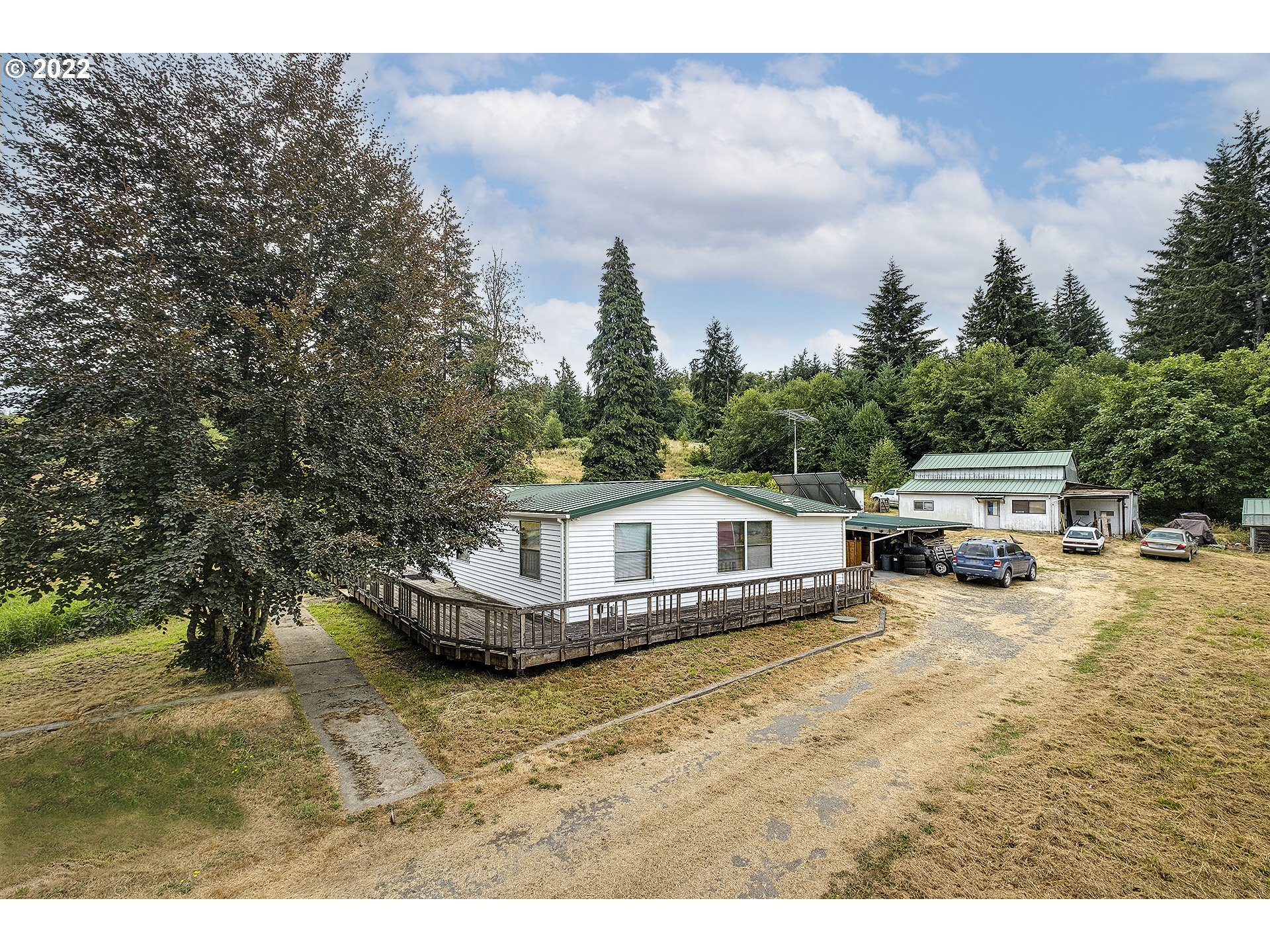 31934 Highland Road Rainier, OR 97048 - Photo 26 of 27 a view of a house with a big yard and large trees