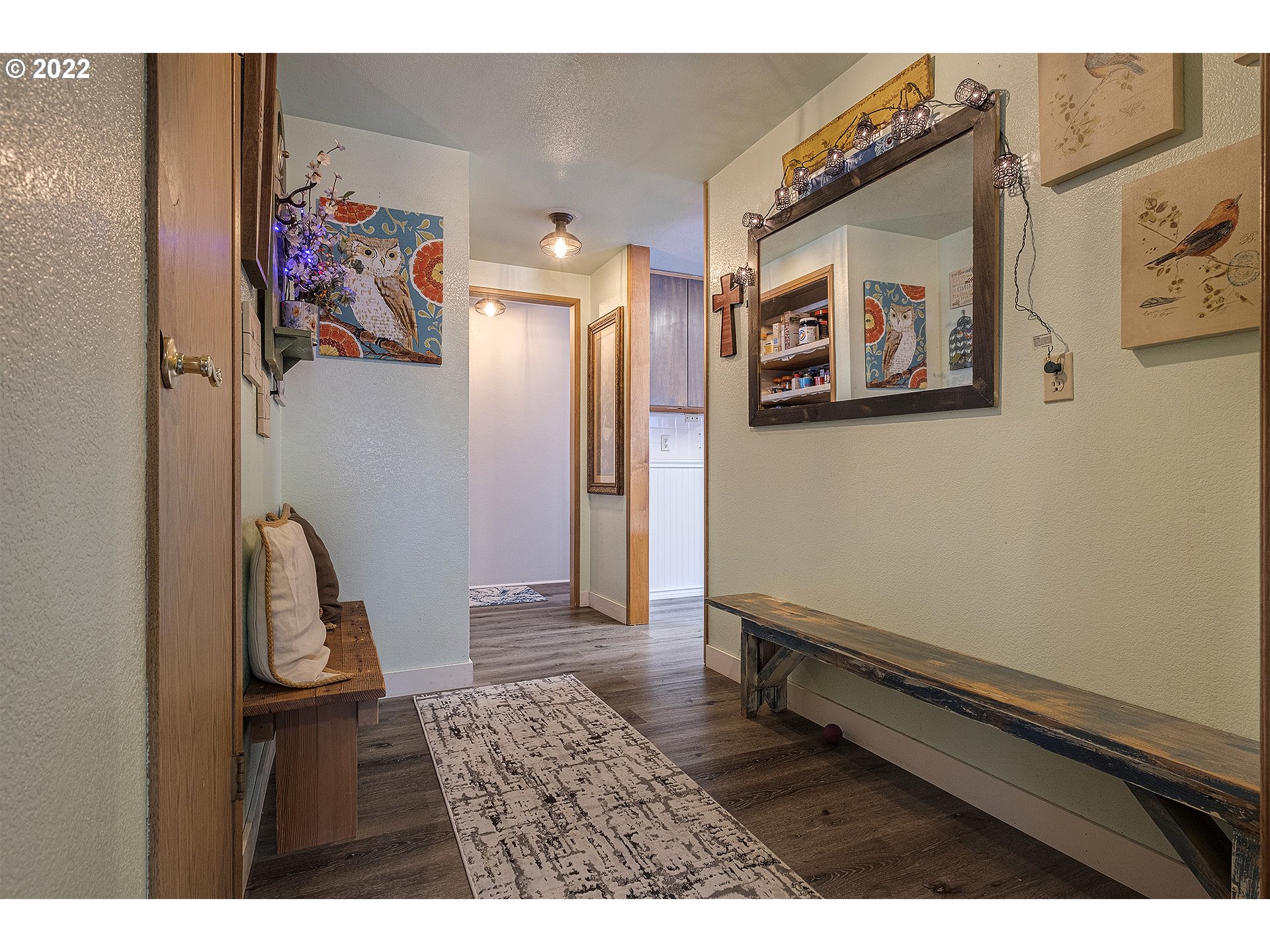 31934 Highland Road Rainier, OR 97048 - Photo 10 of 27 a view of a hallway with paintings on the wall