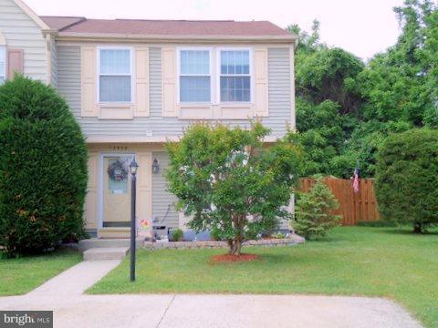 13928 Winding Ridge Lane Centreville, VA 20121 - Photo 1 of 29 a front view of a house with a garden and yard