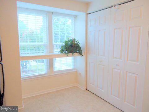 13928 Winding Ridge Lane Centreville, VA 20121 - Photo 13 of 29 a view of an empty room with a window
