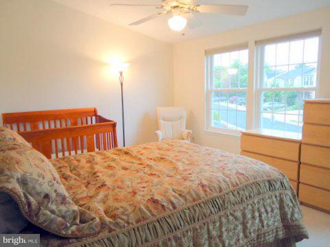13928 Winding Ridge Lane Centreville, VA 20121 - Photo 16 of 29 a bedroom with a bed and window