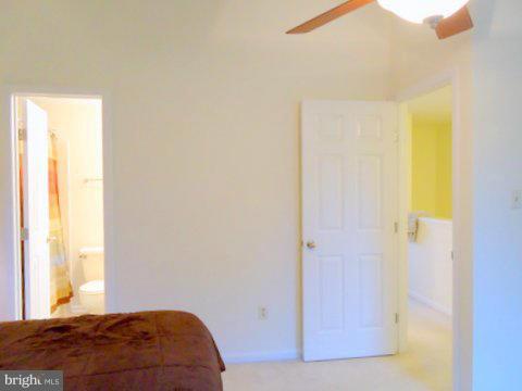 13928 Winding Ridge Lane Centreville, VA 20121 - Photo 23 of 29 a bedroom with a bed and a window