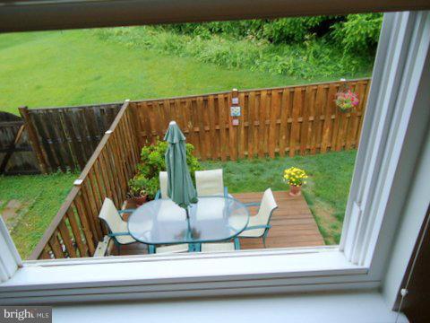 13928 Winding Ridge Lane Centreville, VA 20121 - Photo 26 of 29 a view of backyard with green space and seating area