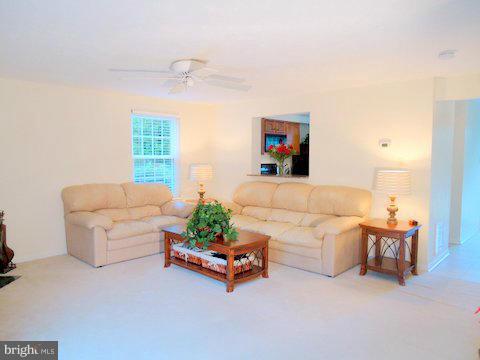 13928 Winding Ridge Lane Centreville, VA 20121 - Photo 4 of 29 a living room with furniture and a couch