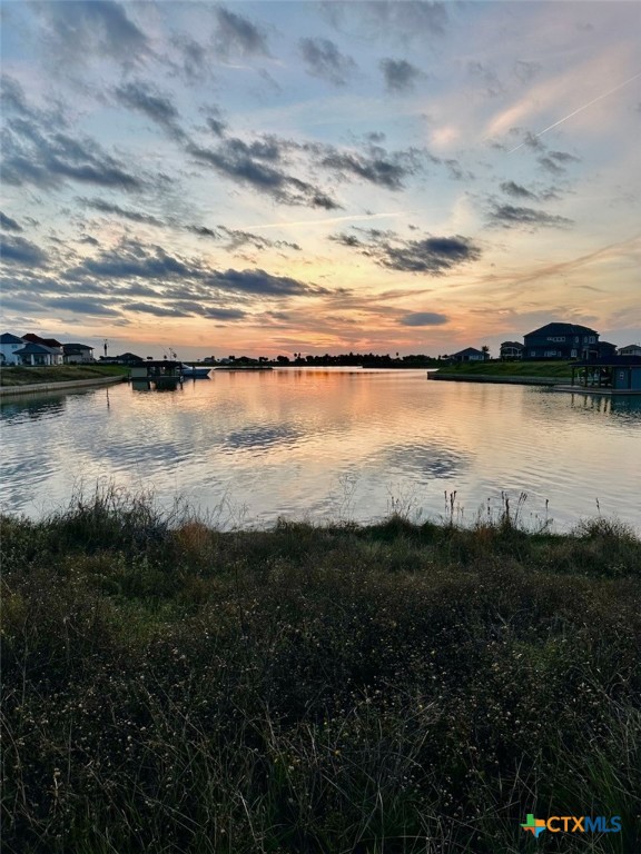 L272 East Lago Loop Road Port O'Connor, TX 77982 - Photo 5 of 11 a view of a lake from a yard