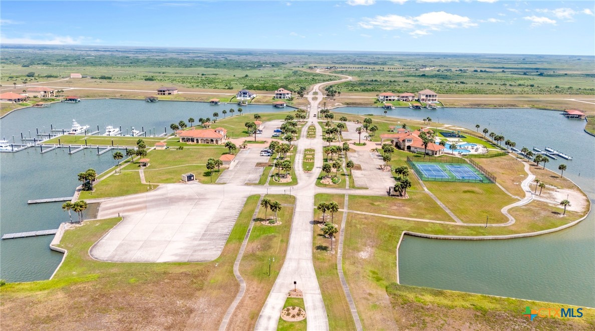L272 East Lago Loop Road Port O'Connor, TX 77982 - Photo 6 of 11 a view of a swimming pool with a table and chairs