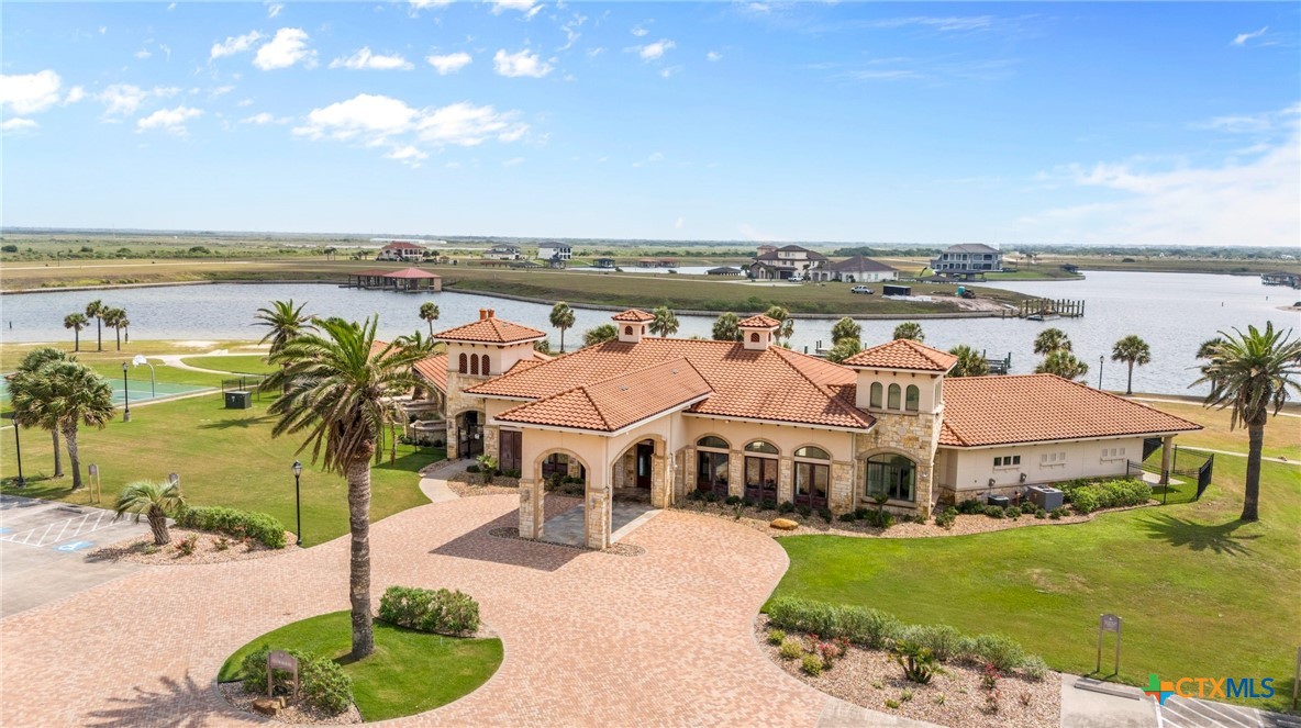 L272 East Lago Loop Road Port O'Connor, TX 77982 - Photo 9 of 11 a view of a house with outdoor space and ocean view