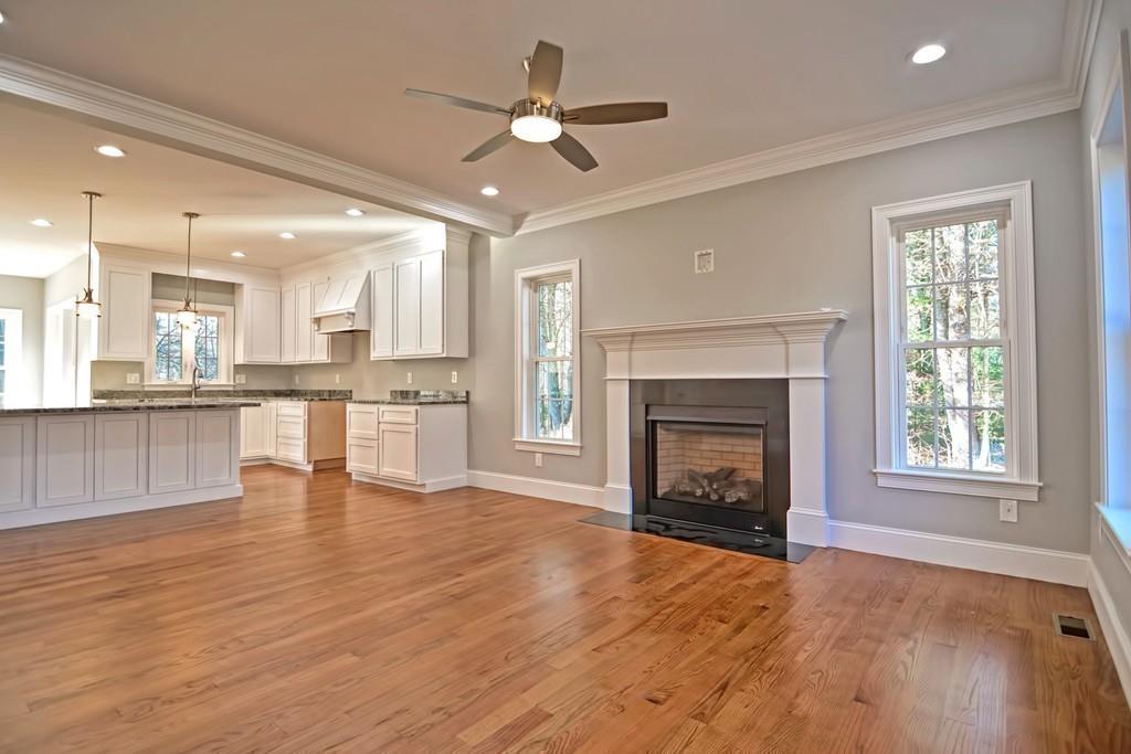 115 High Street Medfield, MA 02052 - Photo 13 of 42 a view of an empty room with a fireplace and window
