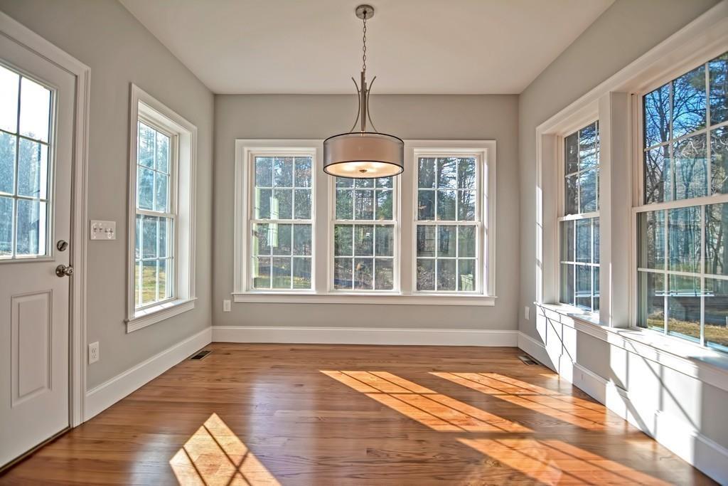 115 High Street Medfield, MA 02052 - Photo 17 of 42 a view of a room with wooden floor and windows