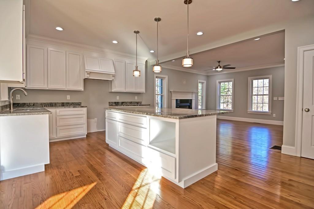 115 High Street Medfield, MA 02052 - Photo 18 of 42 a kitchen with a refrigerator and white cabinets