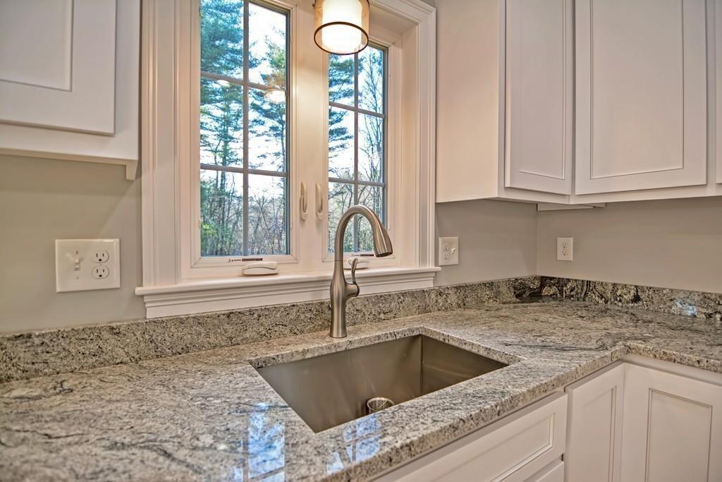 115 High Street Medfield, MA 02052 - Photo 19 of 42 a kitchen with granite countertop a sink window and cabinets