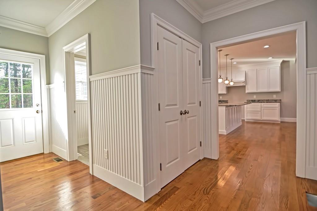115 High Street Medfield, MA 02052 - Photo 22 of 42 a view of a hallway with wooden floor and cabinet