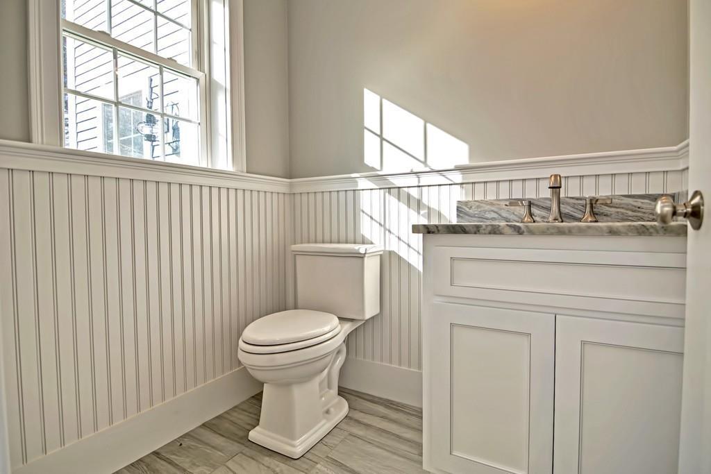 115 High Street Medfield, MA 02052 - Photo 24 of 42 a bathroom with a toilet a sink and a window