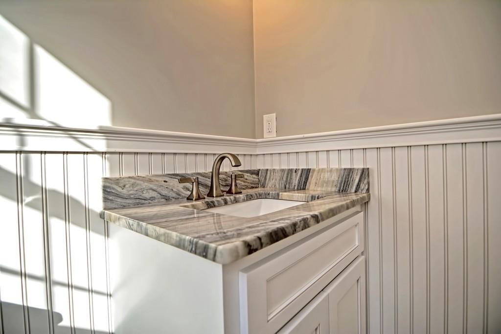 115 High Street Medfield, MA 02052 - Photo 25 of 42 a view of a sink and dishwasher with wooden floor