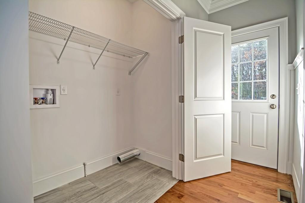 115 High Street Medfield, MA 02052 - Photo 26 of 42 a view of a room with wooden floor and windows