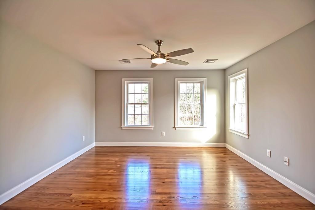 115 High Street Medfield, MA 02052 - Photo 32 of 42 an empty room with wooden floor and windows