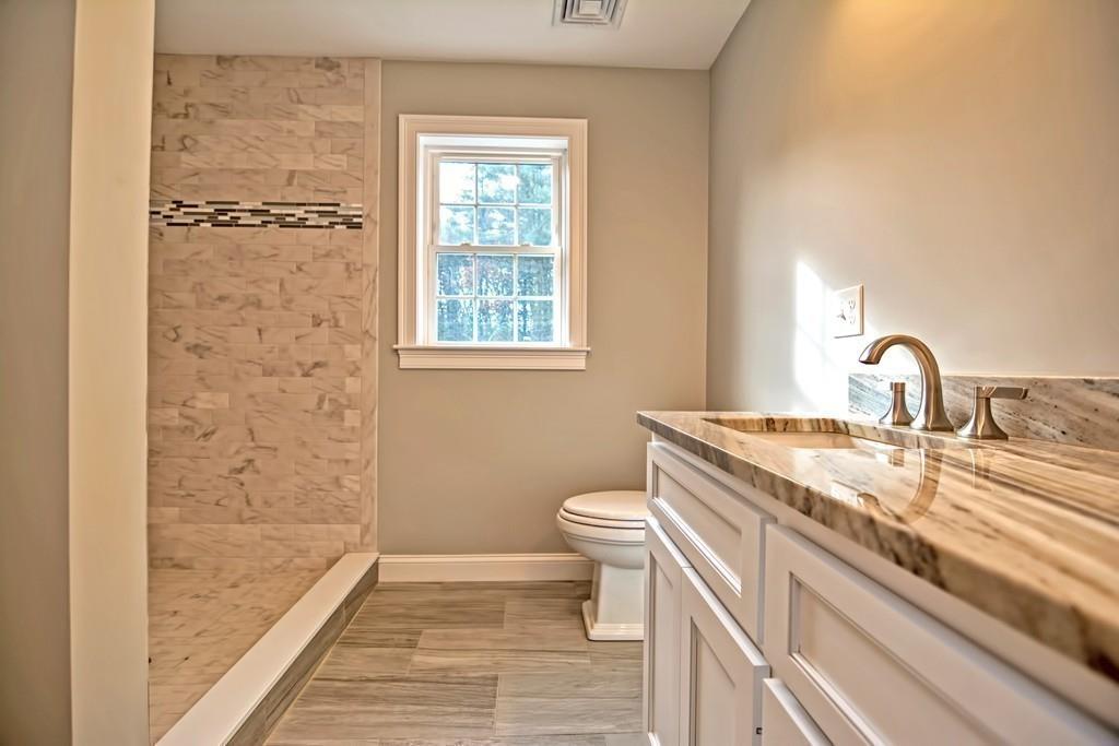 115 High Street Medfield, MA 02052 - Photo 36 of 42 a bathroom with a granite countertop sink toilet and shower