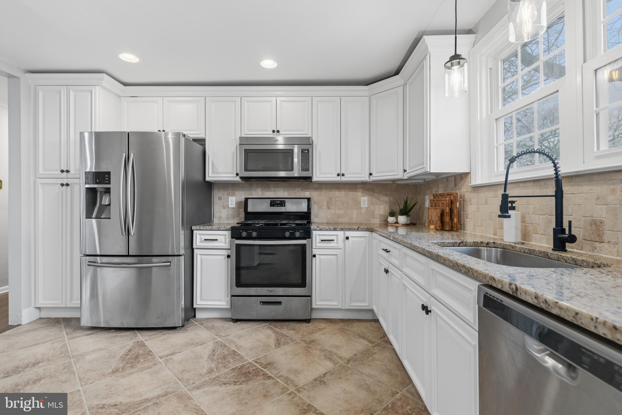 1405 Church Road Wyncote, PA 19095 - Photo 12 of 38 a kitchen with stainless steel appliances granite countertop a refrigerator sink and stove