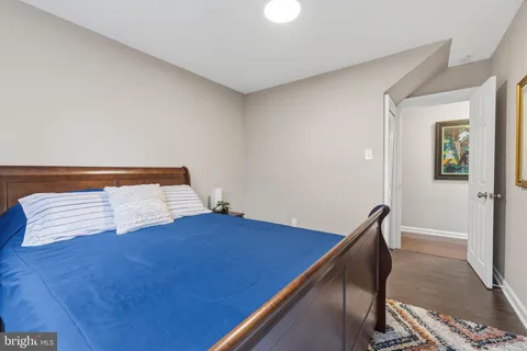 a view of bedroom with furniture and wooden floor