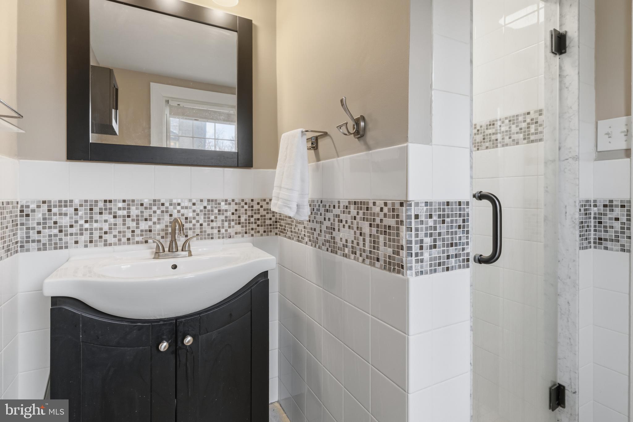 1405 Church Road Wyncote, PA 19095 - Photo 25 of 38 a bathroom with a sink and a mirror