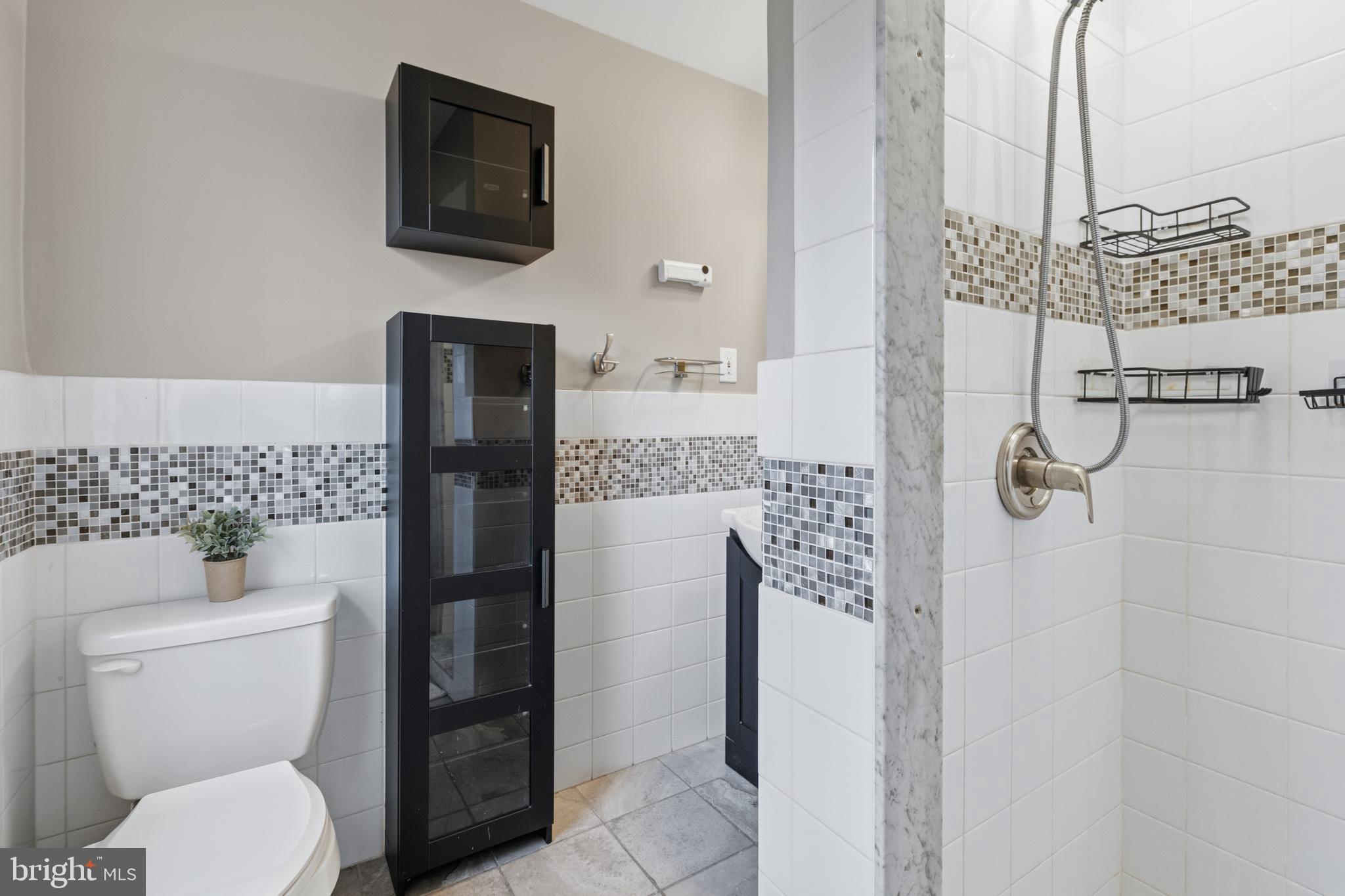 1405 Church Road Wyncote, PA 19095 - Photo 26 of 38 a bathroom with a toilet and a shower