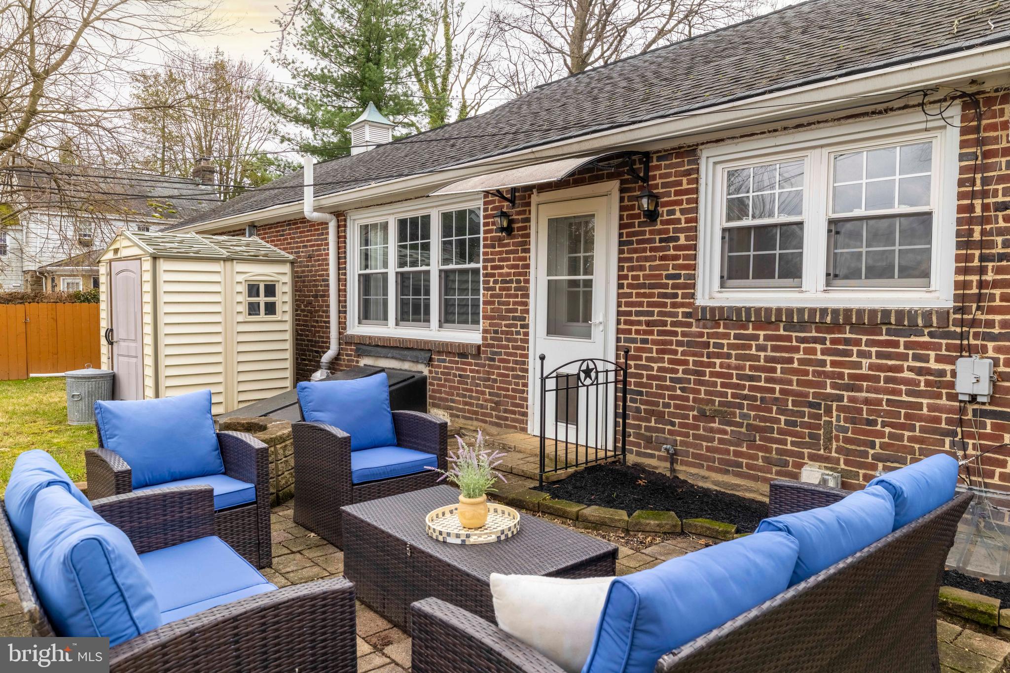 1405 Church Road Wyncote, PA 19095 - Photo 34 of 38 a view of a patio with couches table and chairs and wooden floor