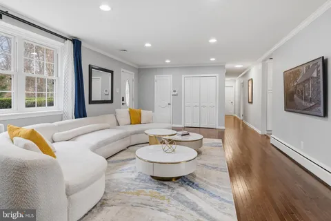 a living room with furniture and a table