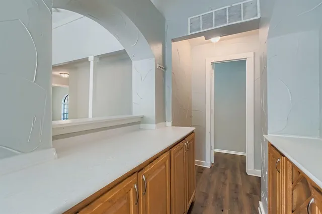 a view of a kitchen from the hallway