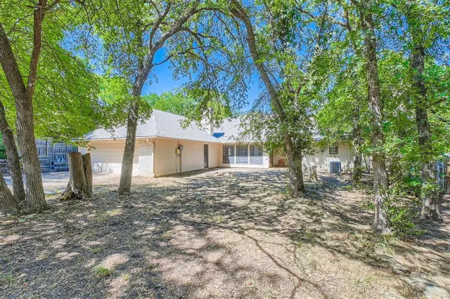 a backyard of a house with lots of green space