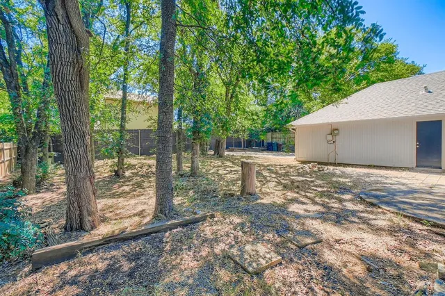 a backyard of a house with lots of green space