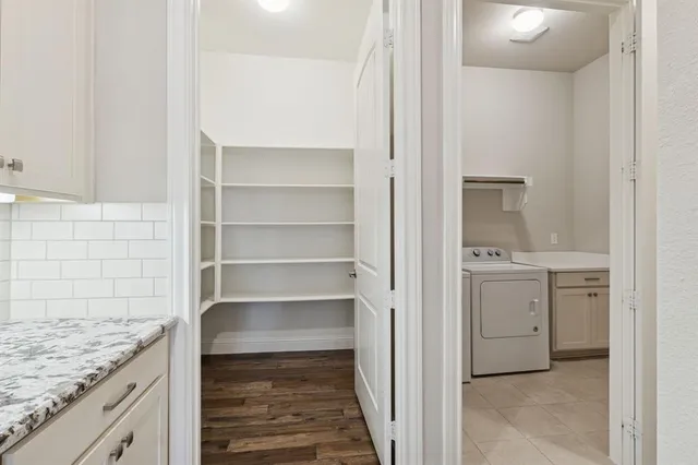 a view of cabinets and wooden floor