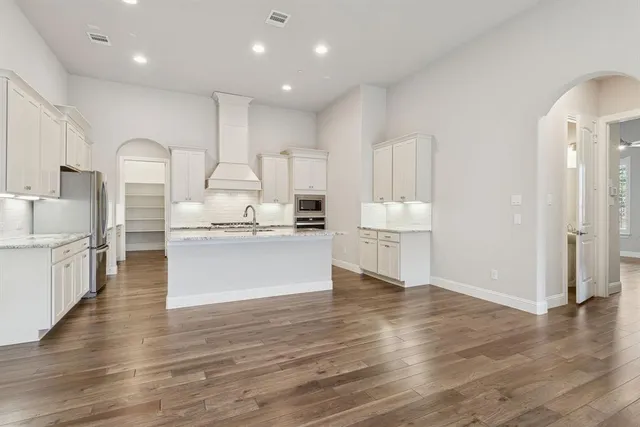 a view of kitchen with wooden floor