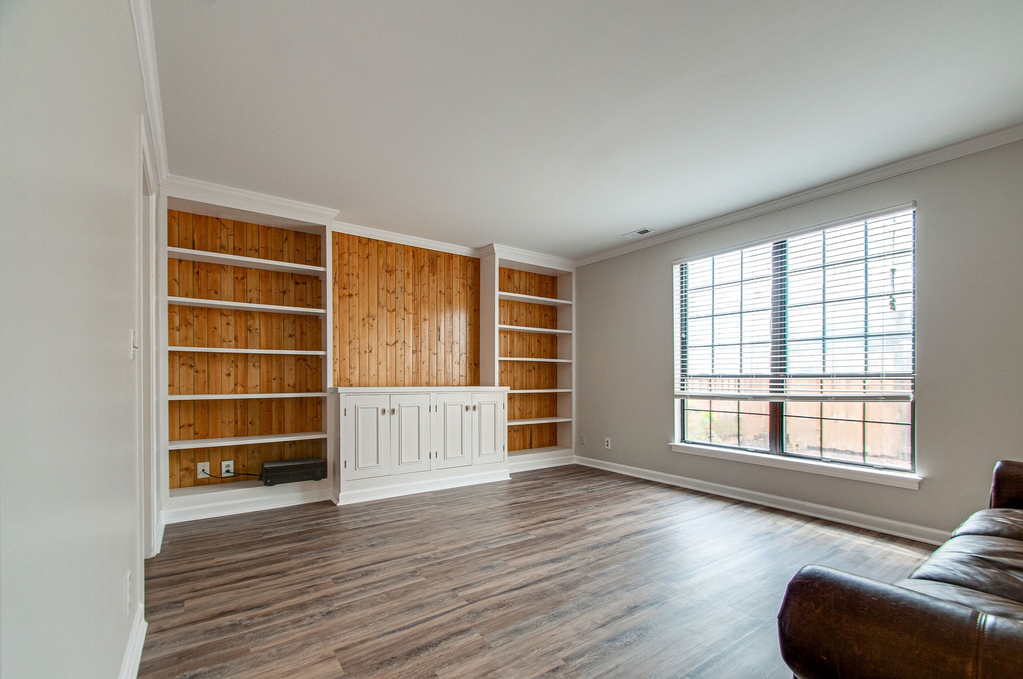 962 General George Patton Road Nashville, TN 37221 - Photo 7 of 22 an empty room with wooden floor and windows