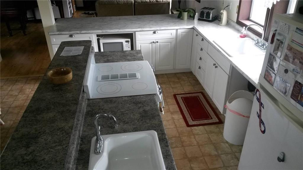 24 South Road South China, ME 04358 - Photo 7 of 27 CENTER ISLAND WITH SINK AND STOVE