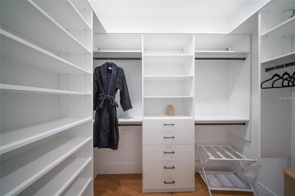 2446 Floyd Street Sarasota, FL 34239 - Photo 20 of 70 a view of walk in closet with clothes and shoes