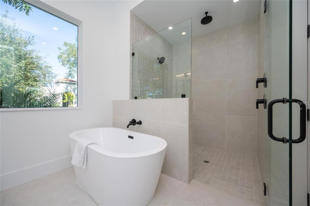 2446 Floyd Street Sarasota, FL 34239 - Photo 24 of 70 a white bath tub sitting next to a shower