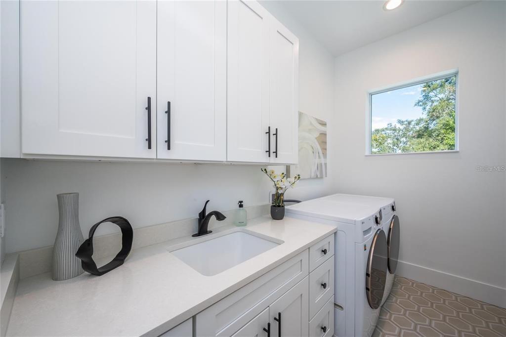 2446 Floyd Street Sarasota, FL 34239 - Photo 35 of 70 a view of cabinets a sink and a stove in a room
