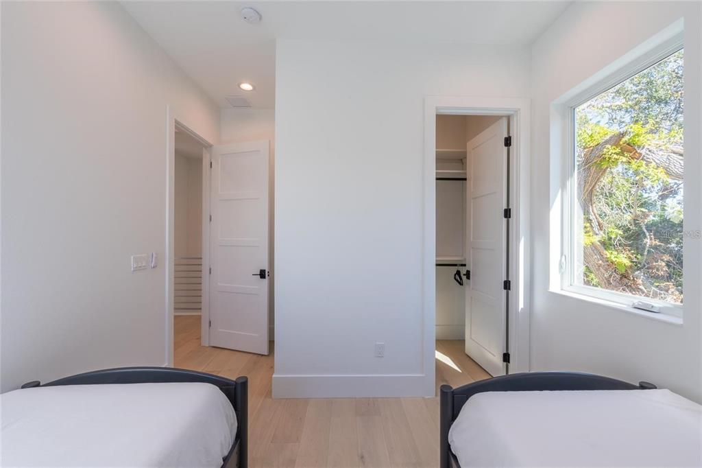 2446 Floyd Street Sarasota, FL 34239 - Photo 37 of 70 a bedroom with a bed and a window