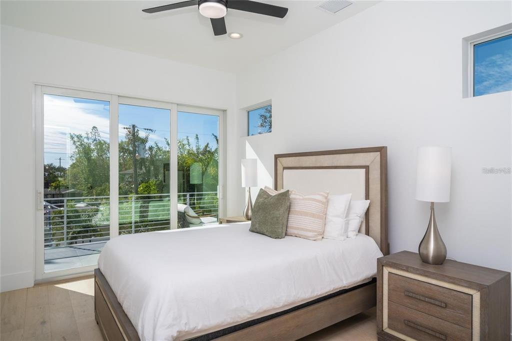 2446 Floyd Street Sarasota, FL 34239 - Photo 42 of 70 a bedroom with a large bed and a window