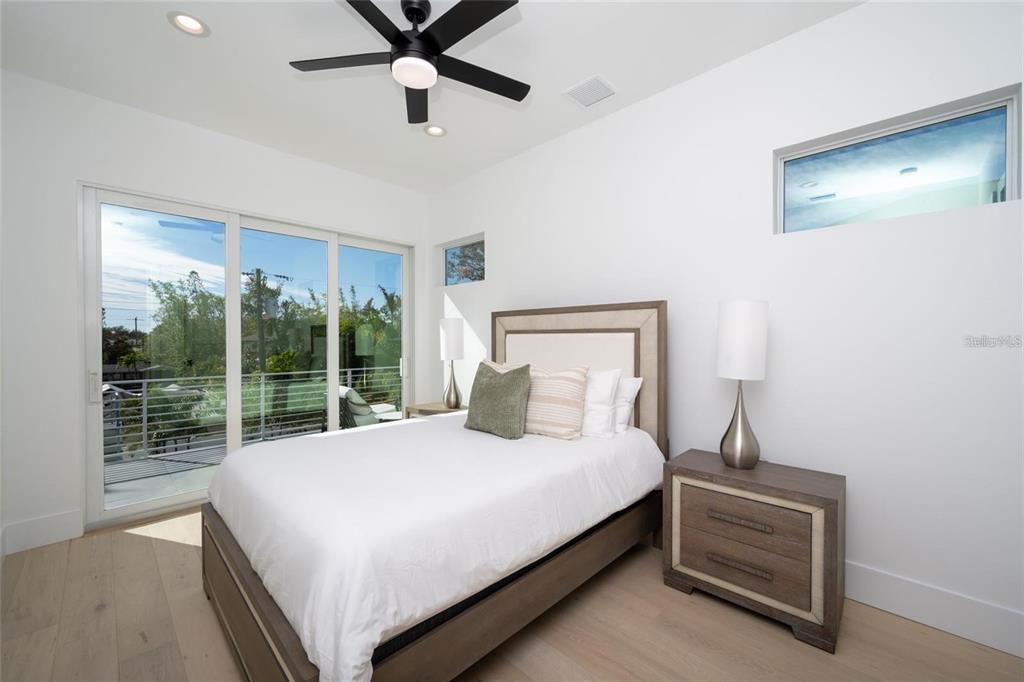 2446 Floyd Street Sarasota, FL 34239 - Photo 44 of 70 a bedroom with a bed and a night stand